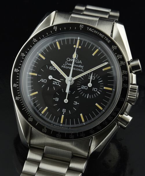 1985 Omega Speedmaster stainless steel moon watch with original dial, hands, vanilla patina, winding crown, and clean caliber 861 movement.