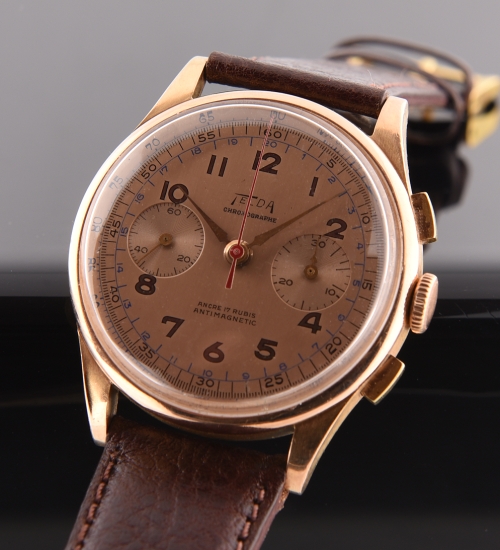 1945 Telda 18k rose-gold chronograph watch with original crisp case, inner metal dust cover, champagne dial, and manual winding movement.