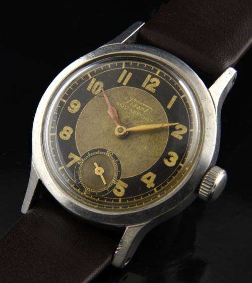 1943 Tissot 31mm Aquasport stainless steel WW2-era watch with original case, two-tone bullseye dial, handset, and manual winding movement.