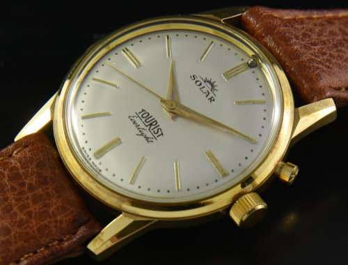 1960s Solar Tourist Everlight gold-plated watch with original silver dial, Dauphine hands, steel-back case, and manual winding movement.
