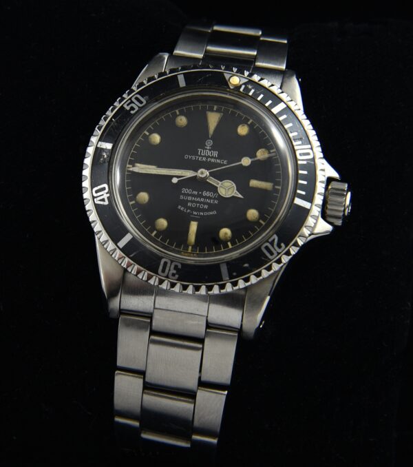 1963 Tudor Submariner stainless steel watch with original gilt glossy dial, fat-font bezel, case, bracelet, and clean caliber 390 movement.