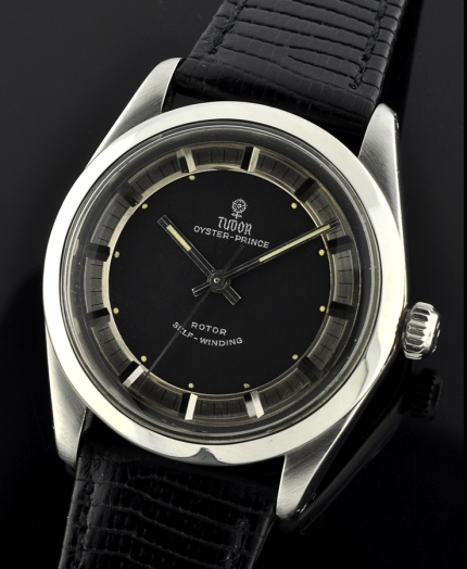 1960s Tudor Oyster-Prince stainless steel watch with original Rolex Oyster case, Tuxedo-style bullseye dial, bezel, and winding crown.