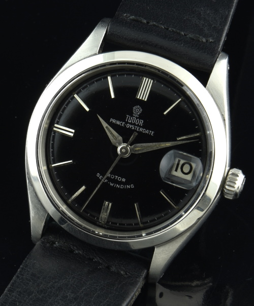 1961 Tudor 35mm Rose stainless steel watch with original black dial, silver gilt print, raised markers, and automatic winding movement.