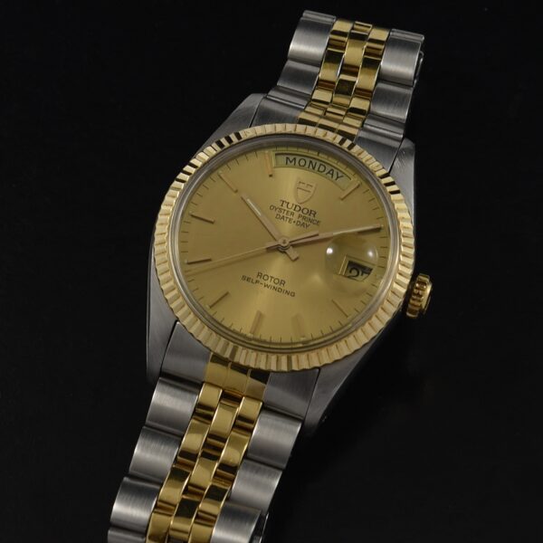 1990s Tudor 35.5mm Day-Date automatic-winding watch with a gold bezel, two-tone plated steel Jubilee bracelet, and original champagne dial.