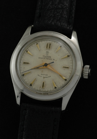 1959 Tudor Oyster Prince 34 Junior stainless steel watch with original case, honeycomb-patterned dial, and clean rotor automatic movement.