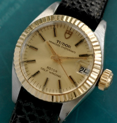 Ladies Tudor Princess Oysterdate with a 23mm two-tone case, 14k gold bezel, and Rolex winding crown. This watch dates to the late 1970s.