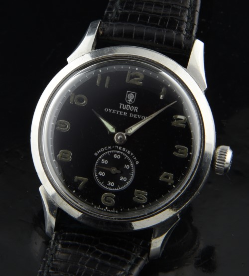 1947 Tudor 34mm Oyster Devon stainless steel watch with original black dial, case, crown, and fine, clean, accurate manual winding movement.
