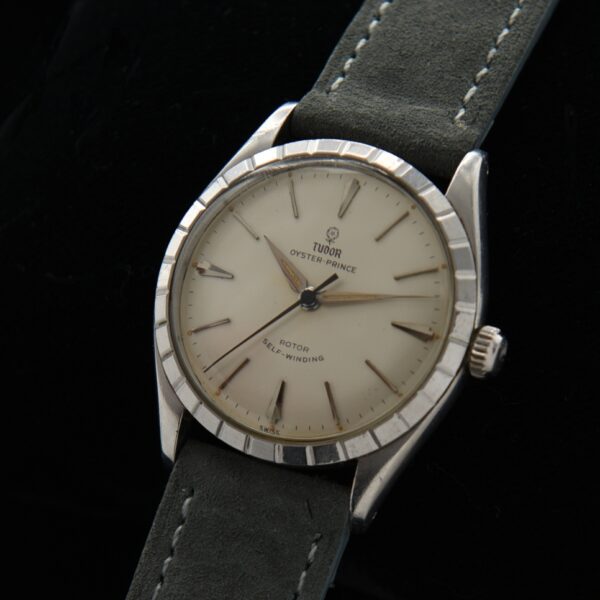 Rare 1959 Tudor Prince 34mm stainless steel watch with original bezel, dial, elongated baton/arrow markers, and automatic winding movement.