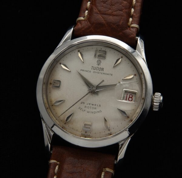 1959 Tudor Prince 33mm Oysterdate stainless steel watch with original roulette dial, Arabic numerals, hands, and automatic winding movement.