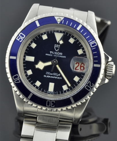 Tudor Prince Oysterdate Submariner 39.5mm stainless steel watch with military style blue snowflake dial, gleaming case, and matching hands.