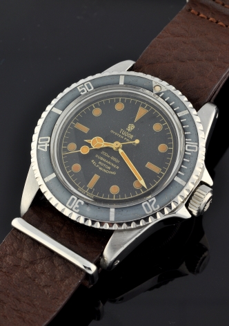 1960 Tudor Oyster Prince Submariner stainless steel watch with original pointed-crown-guard case, restored dial/hands, and faded bezel.