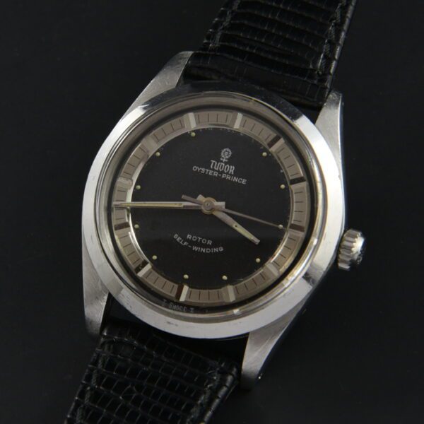 1960s Tudor 34mm Tuxedo stainless steel watch with original dial, hands, Rolex Oyster case, and clean ETA-made automatic winding movement.