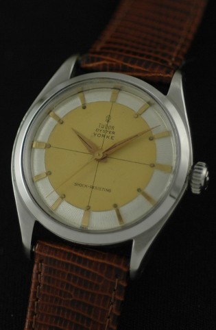 1956 Tudor Oyster Yorke stainless steel watch with original bullseye pie-pan dial, Dauphine hands, rose insignia, case, and winding crown.