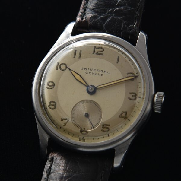 1950s Universal Geneve 34mm stainless steel watch with original narrow bezel, all-dial appearance, hands, and fine manual winding movement.