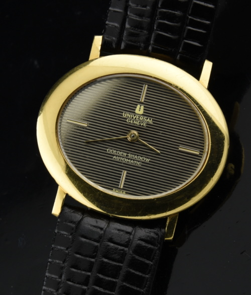 1970s Universal Geneve 35.5mm Golden Shadow 18k solid-gold watch with original shutter dial, case, crown, and automatic winding movement.