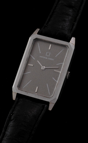 1980s Universal Geneve stainless steel watch with original rectangular case, winding crown, restored dial, and manual winding movement.