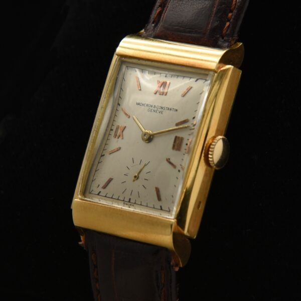 1940s Vacheron Constantin 18k solid-gold watch with original Roman dial, markers, sharp-detailed case, and cleaned manual winding movement.