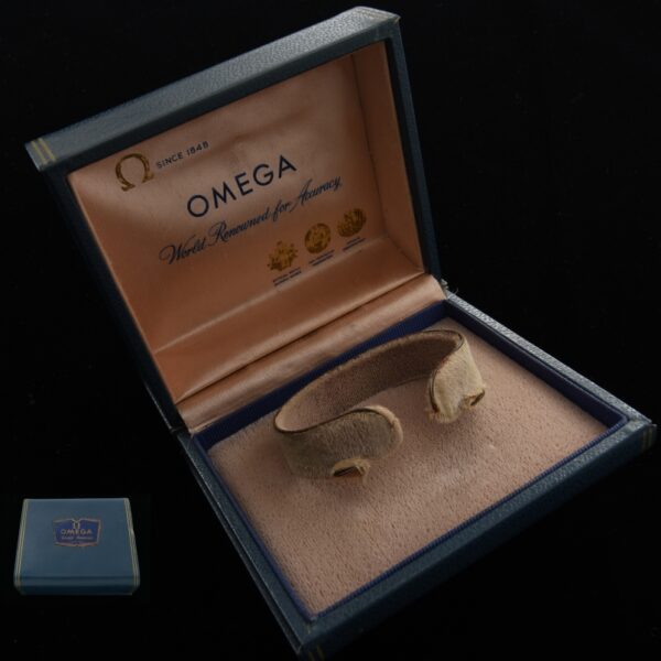 Vintage late 1940s Omega Box 3.75x4" with brass, enamel applied logo, and a silk interior.