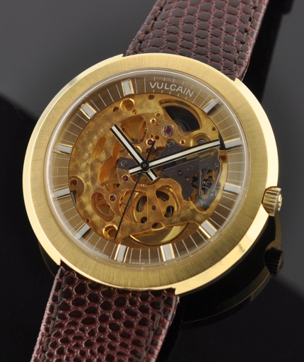 1960s Vulcain gold-plated oversized skeleton watch with original see-through case, signed crystal, and cleaned automatic winding movement.