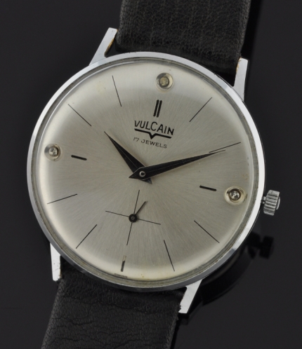 1960s Vulcain stainless steel watch with original 6.75mm-thin case, narrow bezel, dial, and authentic diamonds at 12:00, 3:00, and 9:00.