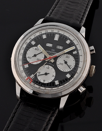 1960s Wakmann stainless steel triple-date chronograph watch with original black dial, baton hands, and cleaned Valjoux 723 manual movement.