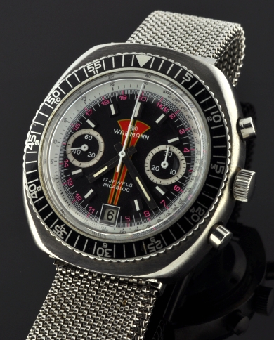 1960s Wakmann stainless steel chronograph watch with original case, turning bezel, dial, chainmail-style bracelet, and Valjoux movement.