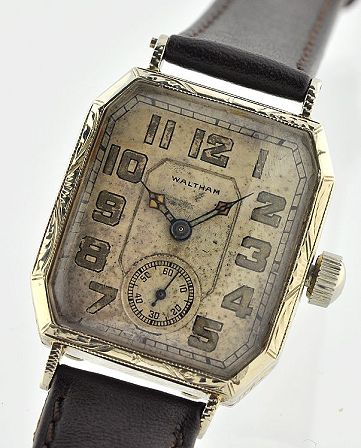 1920s Waltham 14k white-gold watch with original hand-carved filigree case, untouched dial, skeleton hands, and manual winding movement.