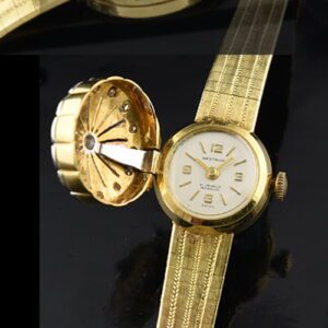 1960s Westbury 18k solid-gold ladies watch with original authentic diamonds, flip-top, integrated bracelet, and manual winding movement.