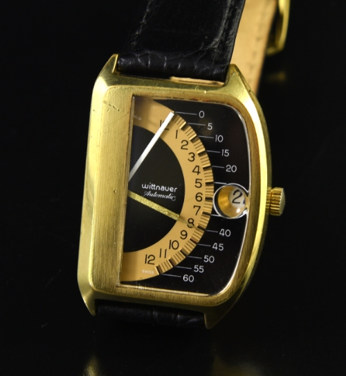 1975 Wittnauer Futurama Sector 1000 gold-plated watch with original large case, two-tone retrograde dial, and automatic winding movement.