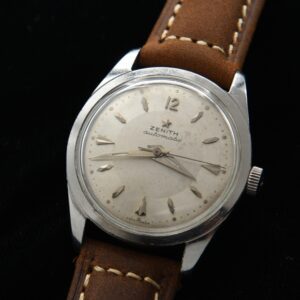 1960s Zenith 33mm stainless steel watch with original two-tone bullseye dial, Dauphine hands, crown, and fine automatic winding movement.