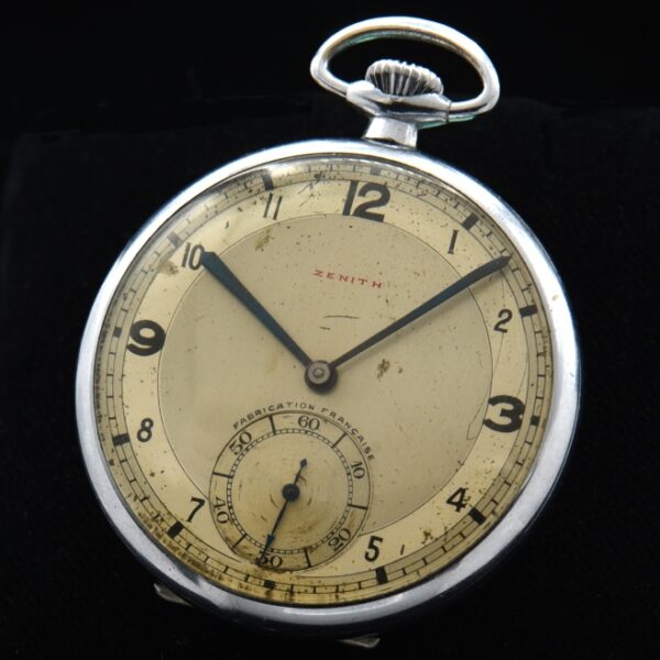 1930s Zenith 45.5mm stainless steel pocket watch with original art deco dial, chrome case, manual winding movement, and blued steel hands.
