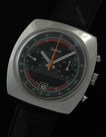 1970s Zodiac stainless steel chronograph watch with original black/slate-grey/red dial, date aperture, and Valjoux 7734 manual movement.