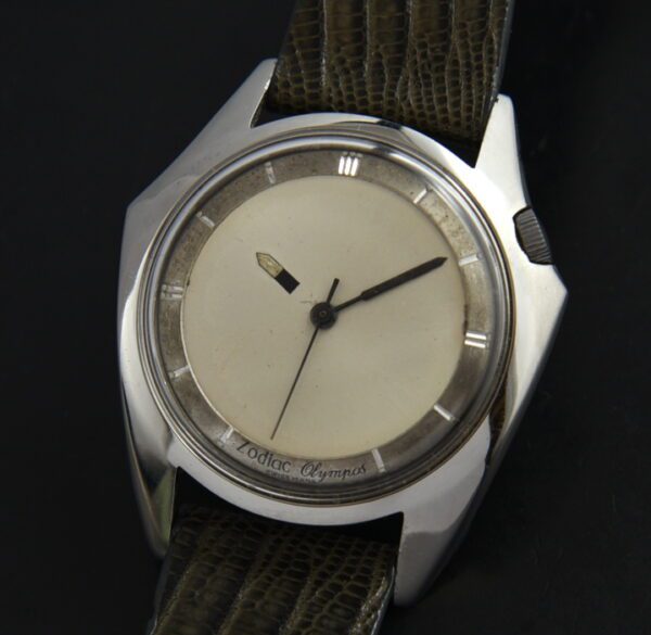 1961 Zodiac 36mm Olympos stainless steel watch with original case, offset winding crown, dial, striking hands, and clean automatic movement.