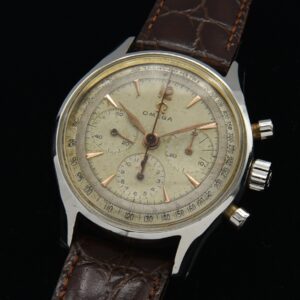 1951 Omega stainless steel chronograph watch with original dial, tachymeter scale, golden arrow markers, and famous caliber 321 movement.