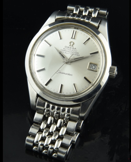 1969 Omega 35mm Seamaster stainless steel watch with original silver dial, beads-of-rice bracelet, and chronometer-grade automatic movement.