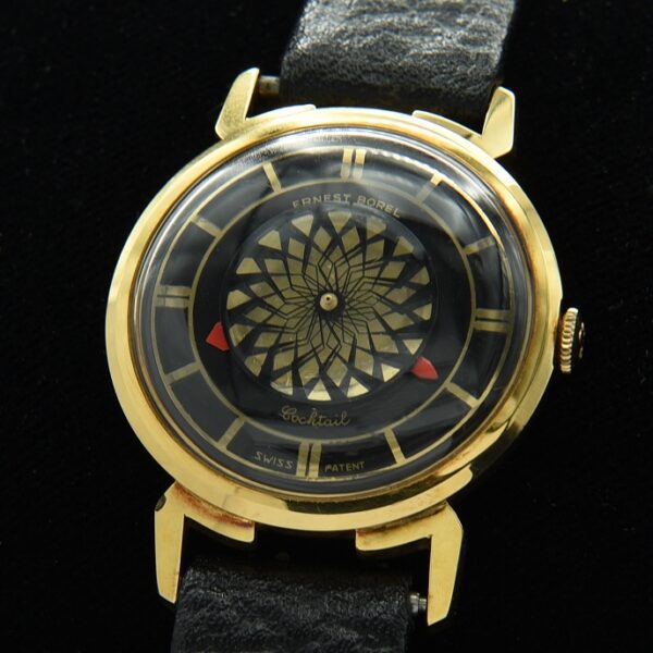 1960s Borel gold-plated men's cocktail watch with original skeleton case, elbow lugs, kaleidoscope dial, crown, and manual winding movement.