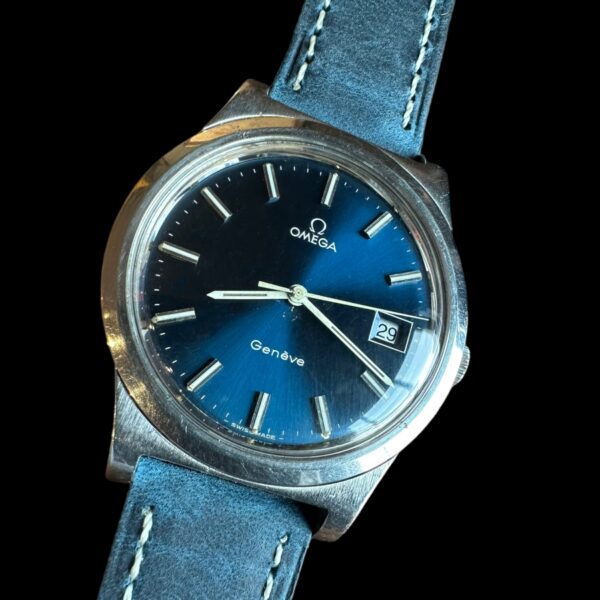 1972 Omega stainless steel watch with original azure-blue dial, white baton hands, case, and cleaned caliber 1030 manual winding movement.