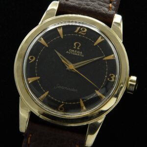 1955 Omega Seamaster 14k gold-filled watch with original notched winding crown, black dial, Breguet numerals, and caliber 500 movement.