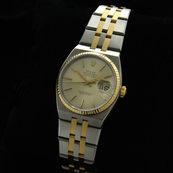 1980 Rolex Datejust Oysterquartz gold and steel watch with original papers, service box, case, tight bracelet, and accurate quartz movement.