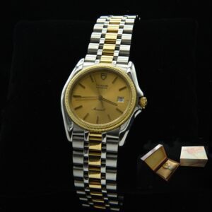 1980s Tudor Monarch stainless steel quartz Rolex watch with original box, case, solid-gold accents, bezel, setting crown, and new battery.