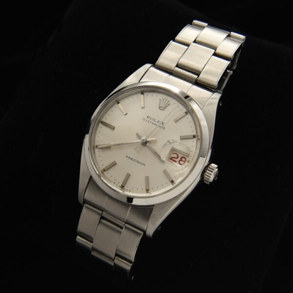 This is an uncommon and early vintage 1958 Rolex Oysterdate ref. 6494 having the seldom seen roulette date feature.