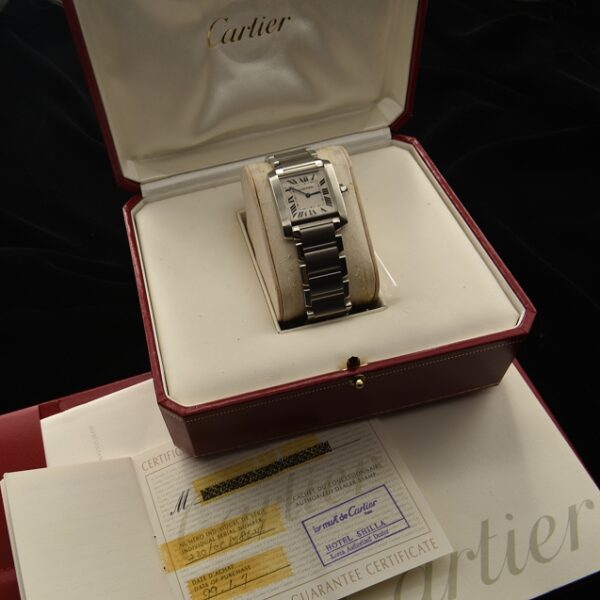 This Cartier reference 2301 modern Tank Francaise measures 25x30mm in stainless steel. Like new and comes with its box, papers and warranty card.