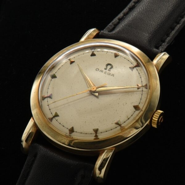 Uncommon vintage 1951 Omega manual wind with raised bowtie markers and Dauphine hands.