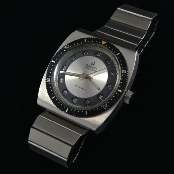 This is a vintage 1970s uncommon Gruen watch known as the Day/Night 24-hour, measuring 40mm in stainless steel.