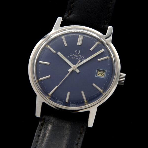 This is a large 35mm Omega automatic with a striking and uncommon original blue dial, having original white baton hands. Blue dials are uncommon.