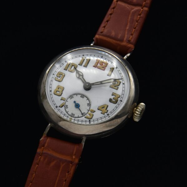 1914 vintage WW1 military watch having a fine porcelain original dial with cathedral hands. It is uncommon to find these with all original luminous intact on both the dial and hands.
