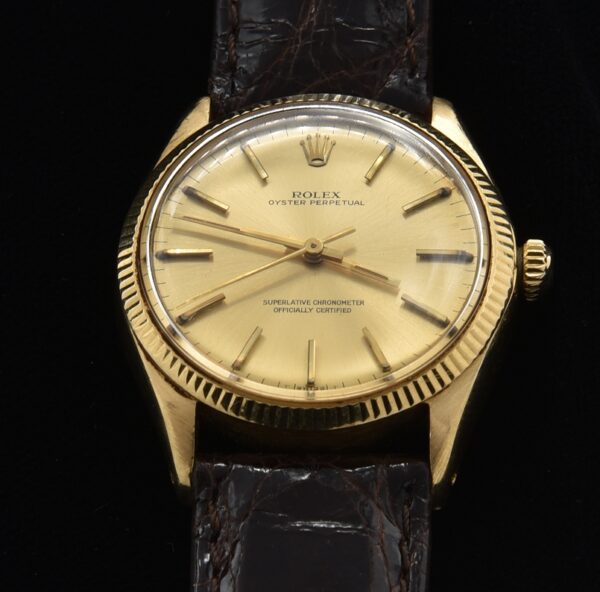 This 18k solid yellow gold Rolex Oyster Perpetual Date is an amazing find and comes complete with box, papers, buckle and original receipt as sold in Hong Kong in 1968.