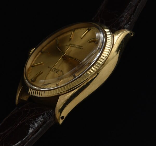 This 18k solid yellow gold Rolex Oyster Perpetual Date is an amazing find and comes complete with box, papers, buckle and original receipt as sold in Hong Kong in 1968.