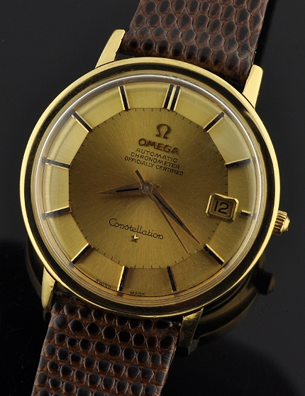 1966 Omega Constellation 18k gold watch with original winding crown, signed crystal, pie-pan dial, Dauphine hands, and caliber 561 movement.