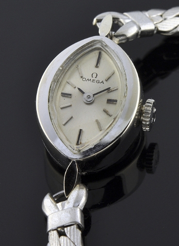 1966 Omega 14k white-gold ladies cocktail watch with original signed winding crown, dial, baton markers, and clean manual winding movement.